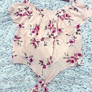 A sugar cute floral top from Love culture. It’s over the shoulder!